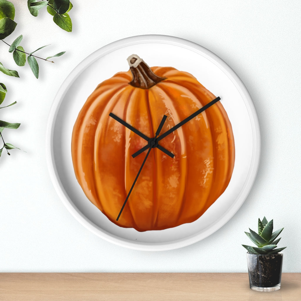 A stylish Pumpkin Wall Clock featuring a wooden frame and plexiglass face, perfect for indoor decor.