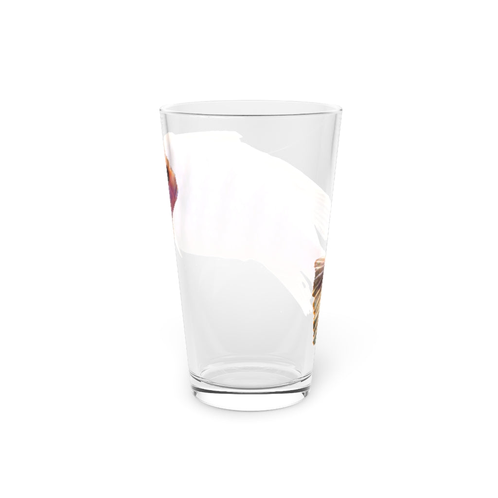 A clear 16oz pint glass featuring a purple fish design, perfect for personalized drinks.