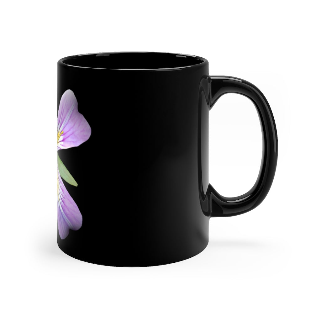 A stylish 11oz black ceramic mug featuring a vibrant purple flower design, perfect for coffee or tea.