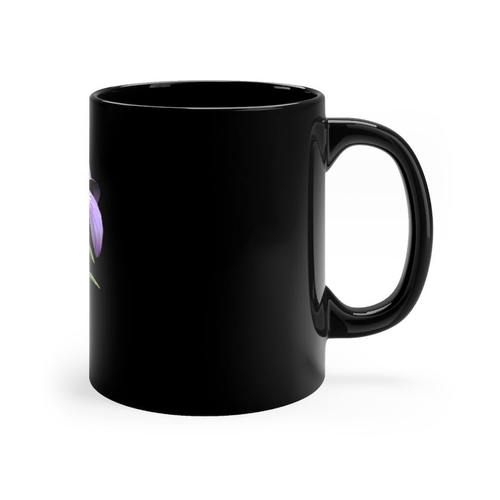 A stylish 11oz black ceramic mug featuring a vibrant purple flower design, perfect for coffee or tea.