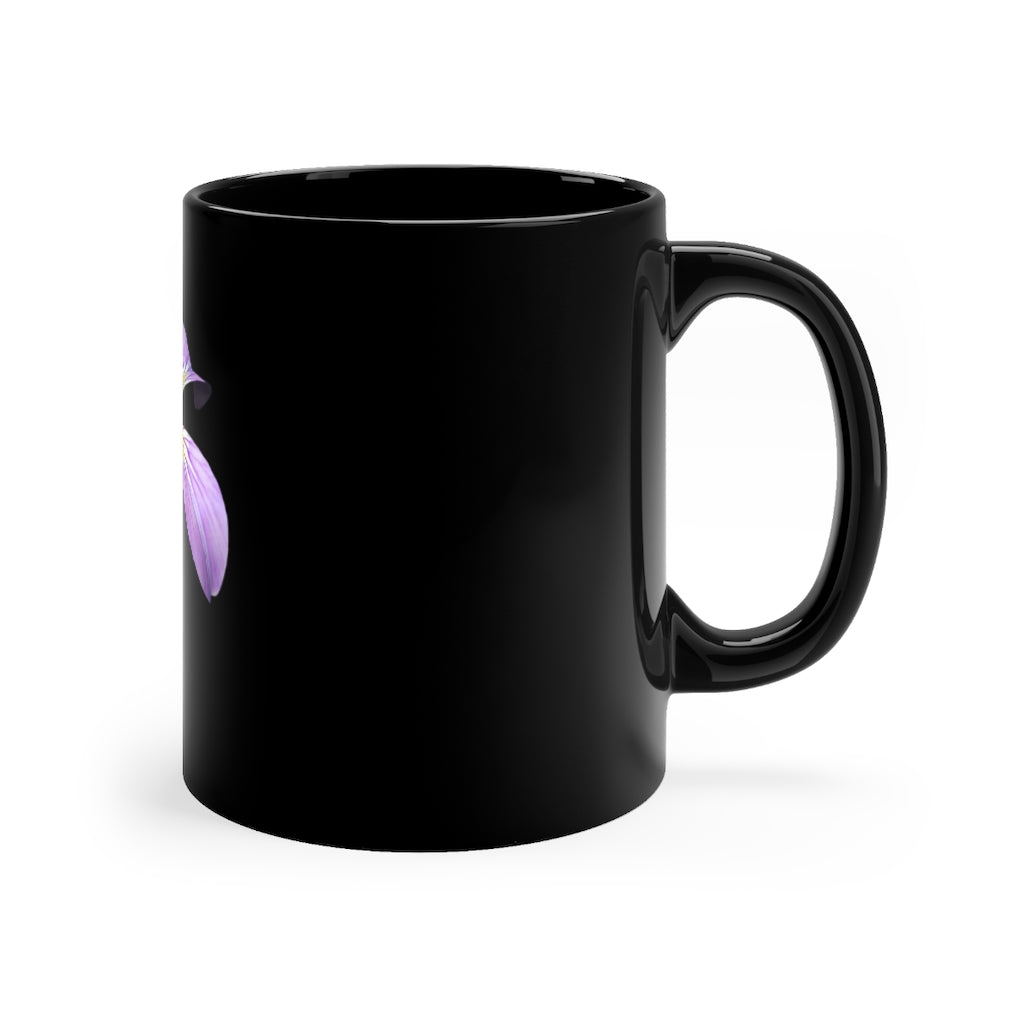 A stylish 11oz black ceramic mug featuring a vibrant purple flower design, perfect for coffee or tea.