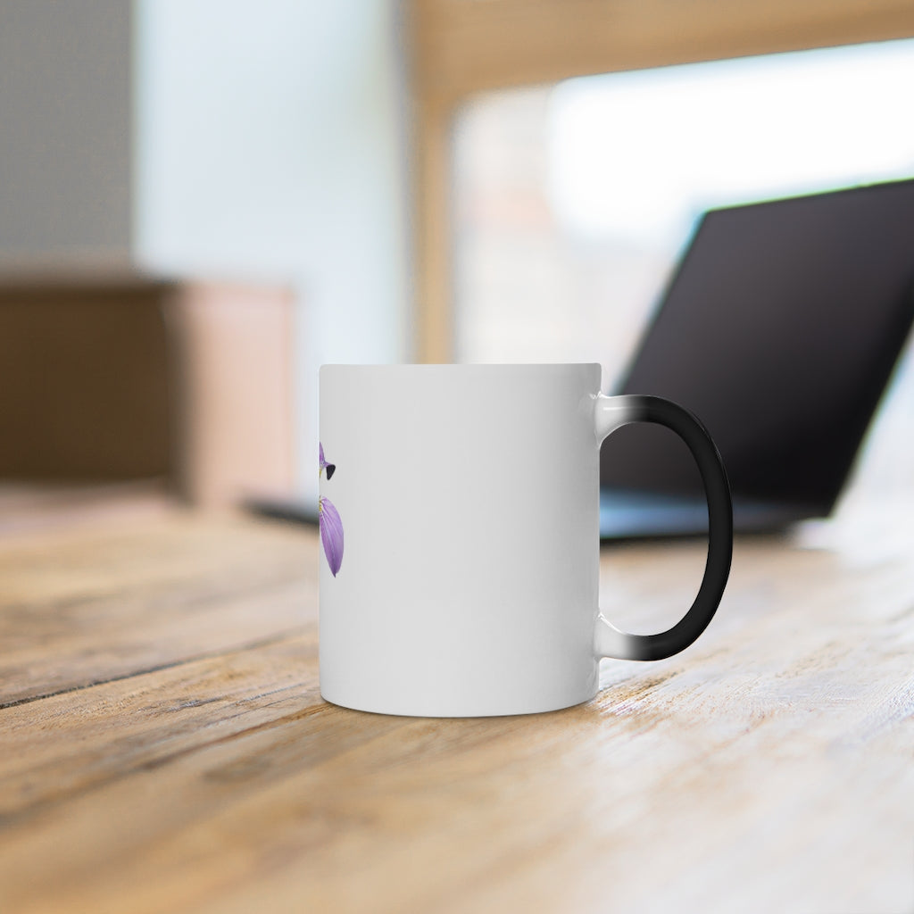 A purple flower color changing mug displaying vibrant floral designs that change color when filled with hot liquid.