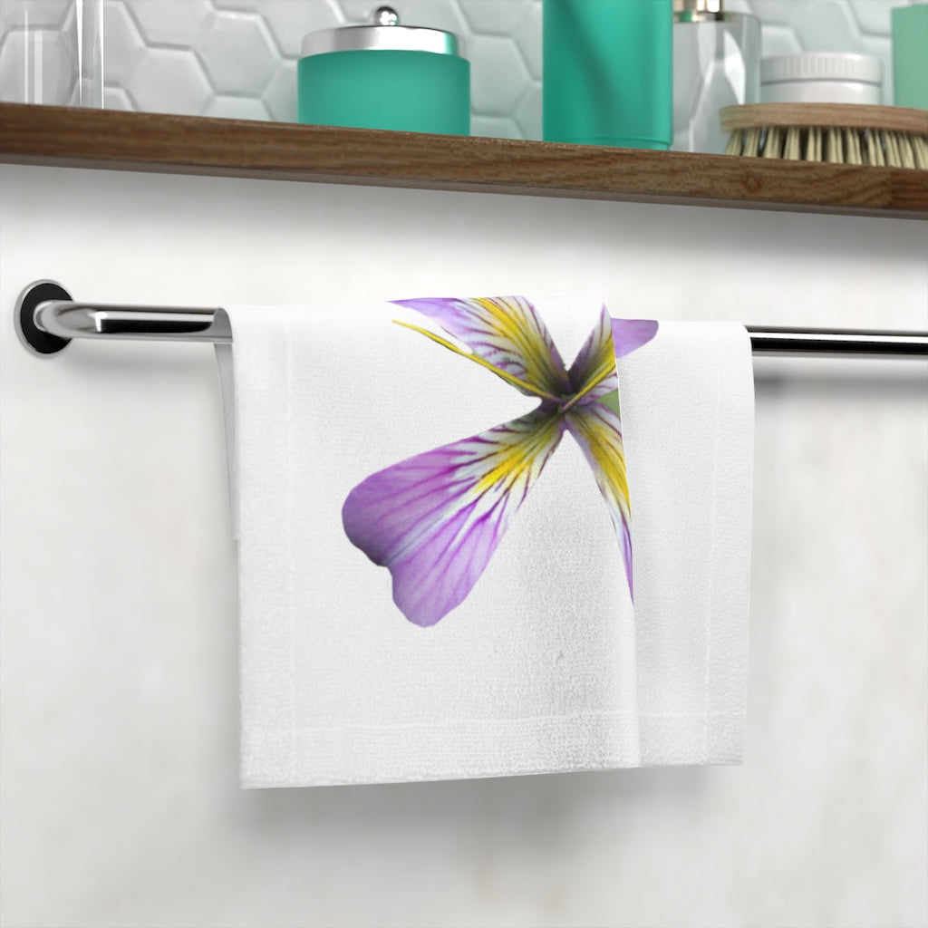 A vibrant Purple Flower Face Towel featuring a colorful floral design on a soft polyester front and absorbent cotton back.