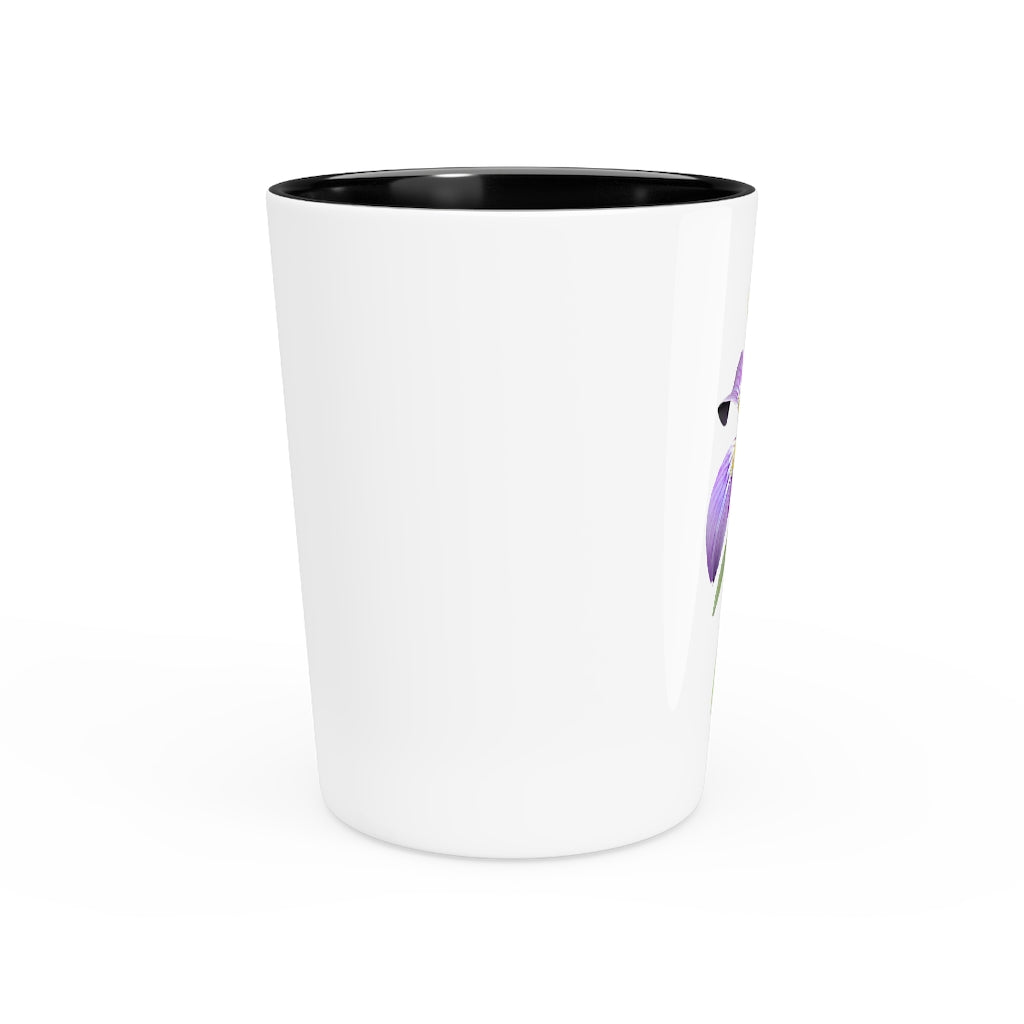 A personalized Purple Flower Shot Glass with a ceramic finish, featuring a vibrant purple floral design and available with a white or black interior.