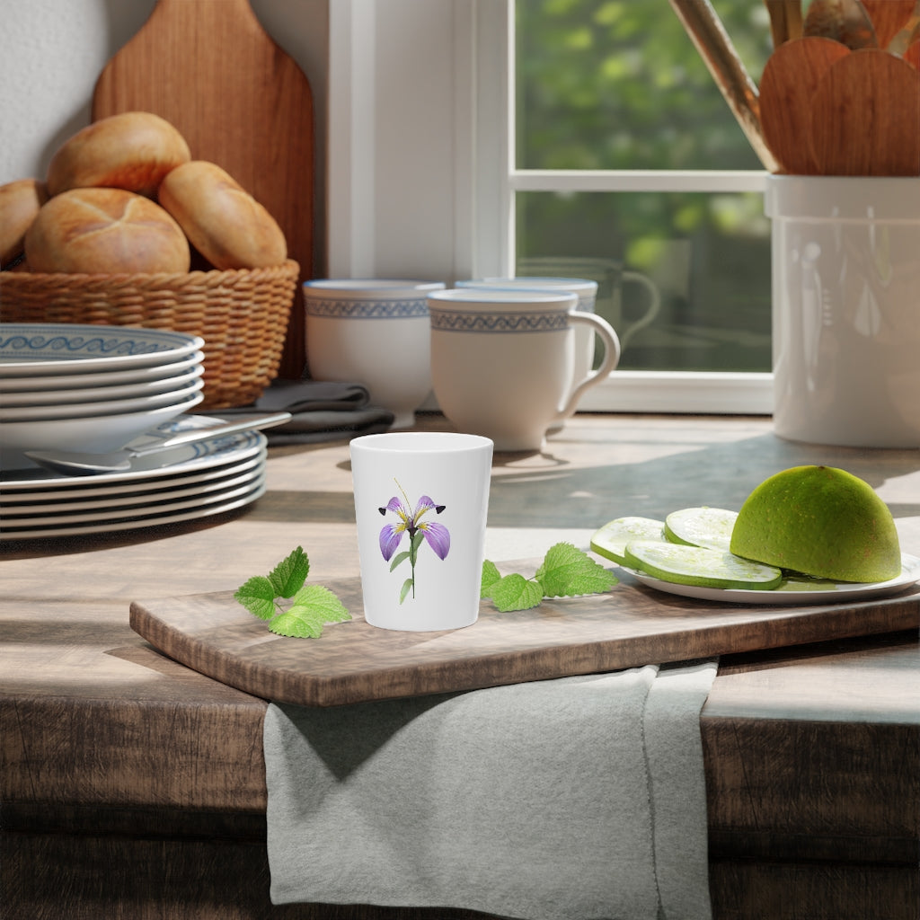 A personalized Purple Flower Shot Glass with a ceramic finish, featuring a vibrant purple floral design and available with a white or black interior.