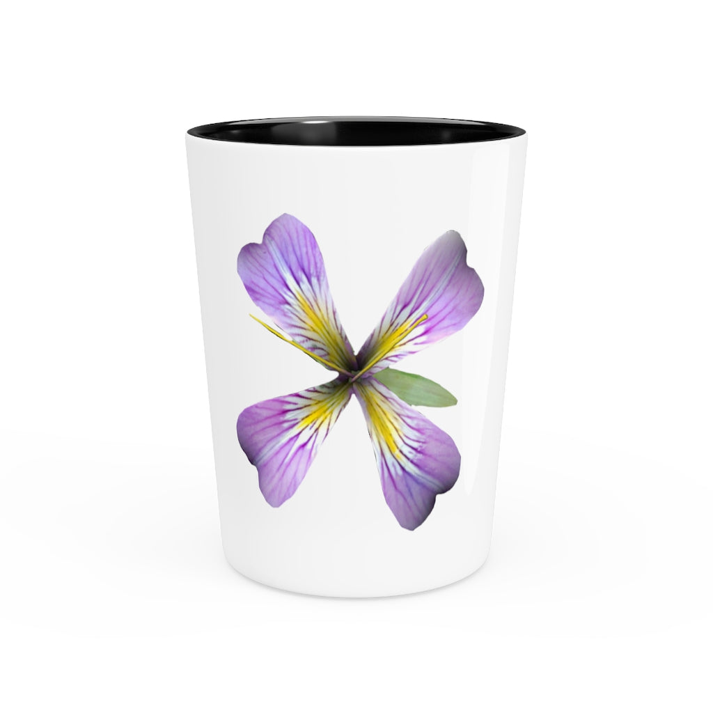 A personalized Purple Flower Shot Glass with a white ceramic finish and a black interior, showcasing its elegant design.