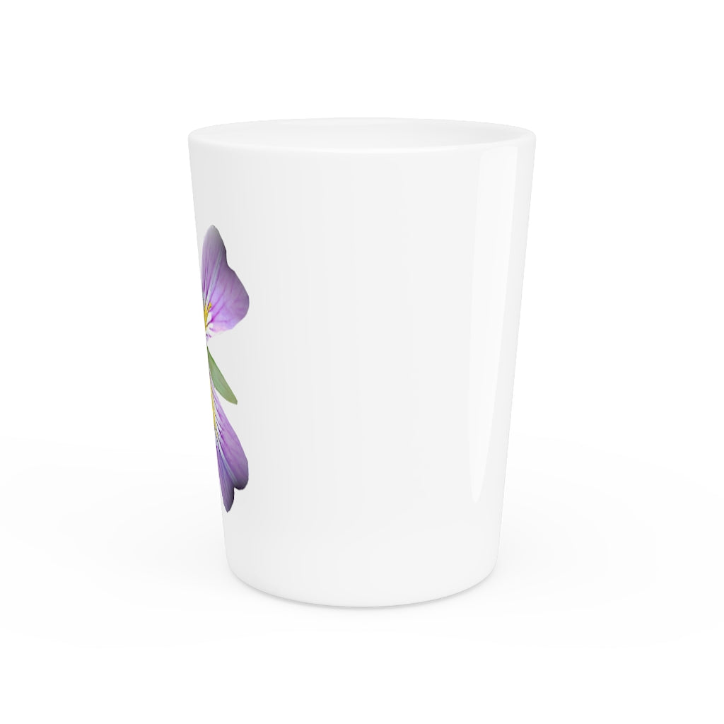 A personalized Purple Flower Shot Glass with a white ceramic finish and a black interior, showcasing its elegant design.