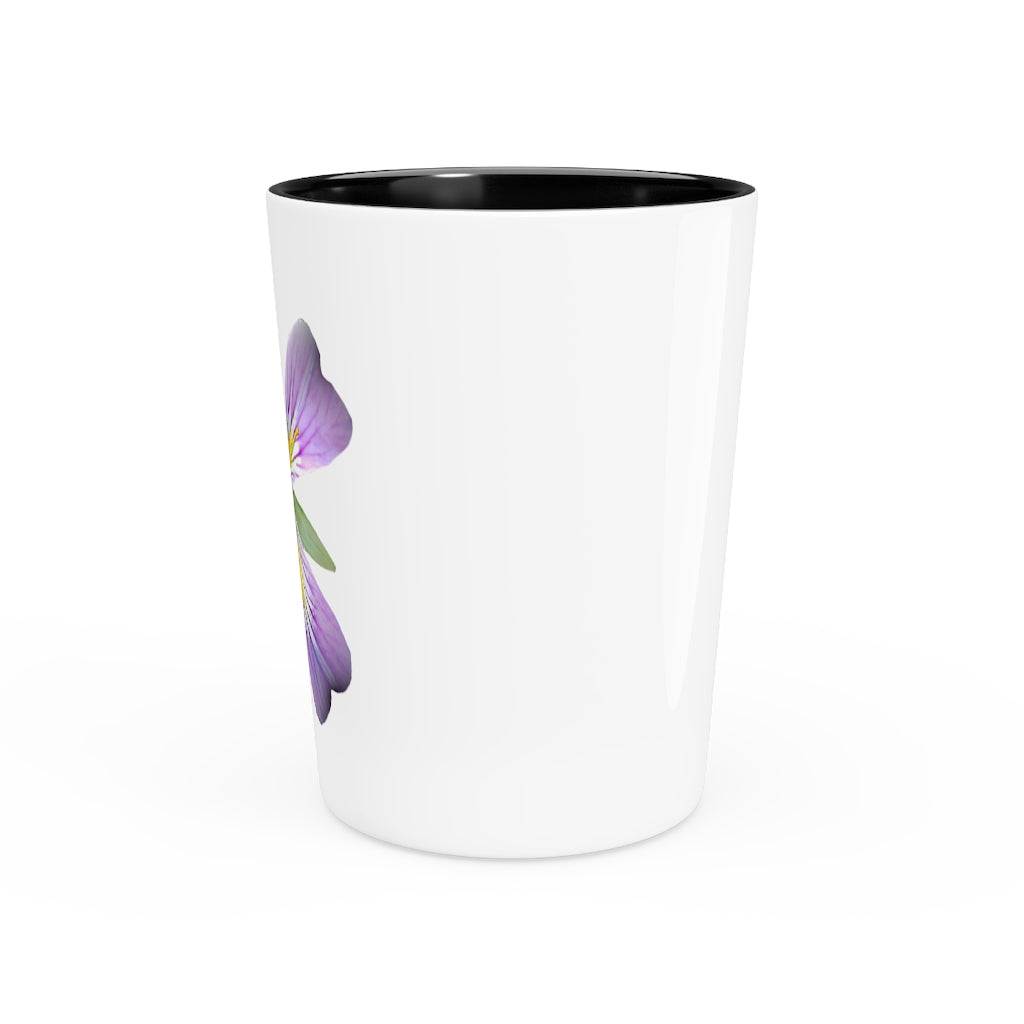 A personalized Purple Flower Shot Glass with a white ceramic finish and a black interior, showcasing its elegant design.