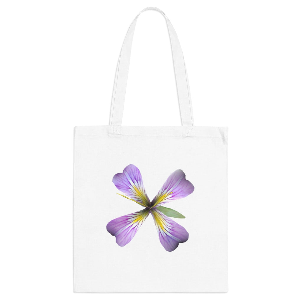 A stylish purple flower tote bag made of 100% cotton with long handles and cross stitching for added durability.