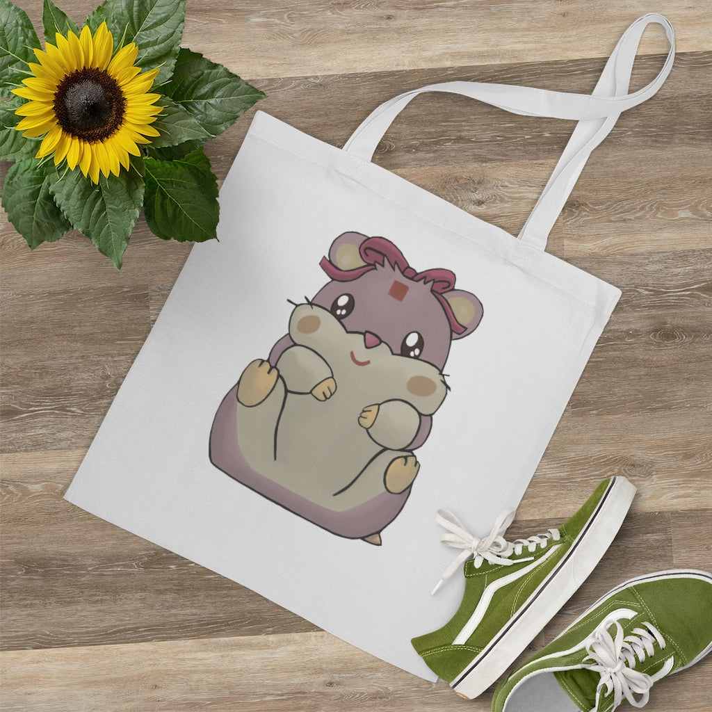 A vibrant Purple Hamster Tote Bag made of 100% cotton, featuring long cross-stitched handles for durability and a colorful design.