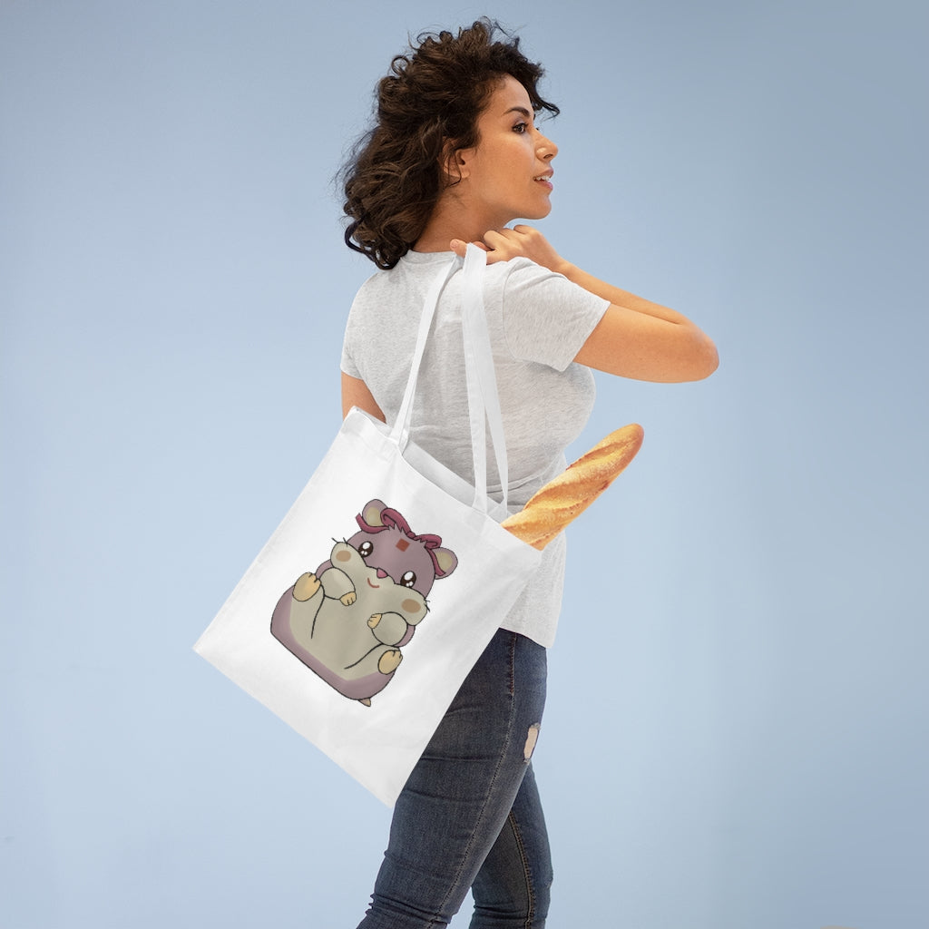 A vibrant Purple Hamster Tote Bag made of 100% cotton, featuring long cross-stitched handles for durability and a colorful design.