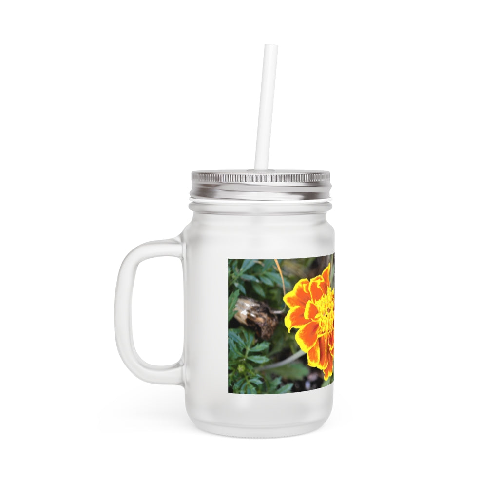 A vibrant Red and Yellow Flower Mason Jar with a straw and lid, showcasing its frosted glass design and floral pattern.