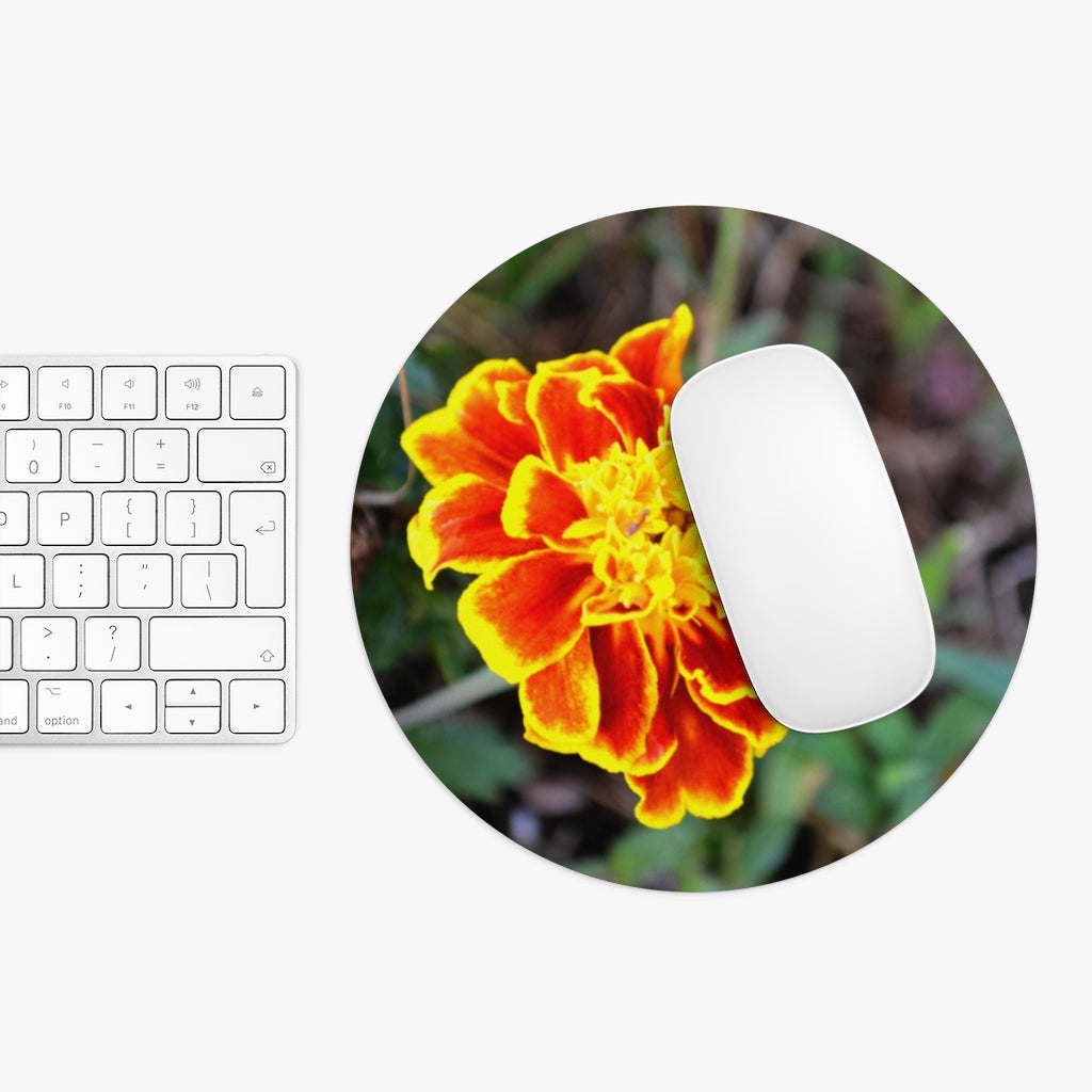 A vibrant Red and Yellow Flower Mouse Pad featuring a floral design, available in round and rectangular shapes with a non-slip rubber bottom.