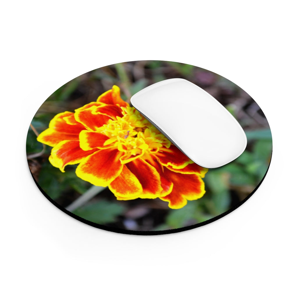 A vibrant Red and Yellow Flower Mouse Pad featuring a floral design, available in round and rectangular shapes with a non-slip rubber bottom.