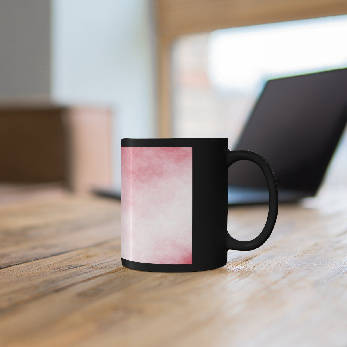 A stylish 11oz black ceramic mug with a C-handle, perfect for coffee, tea, or hot chocolate, featuring customizable designs.