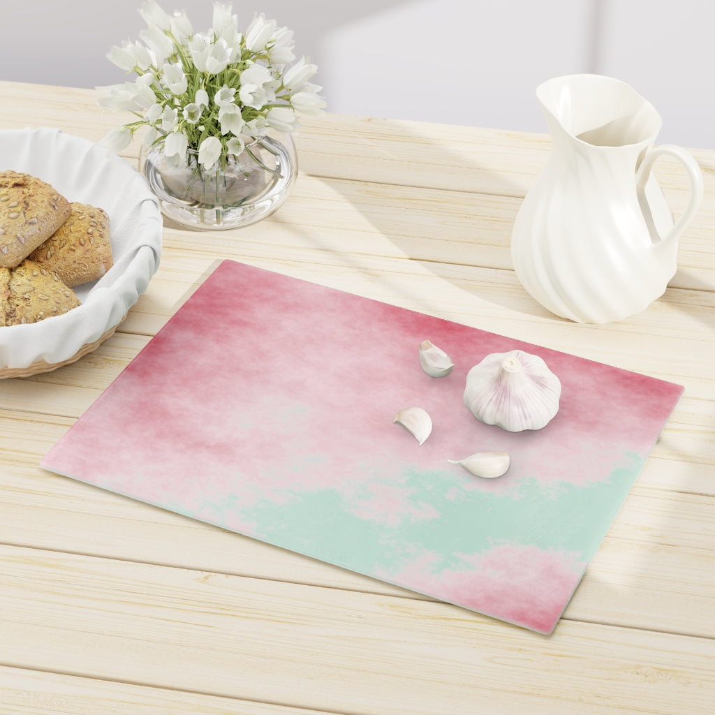 Red Clouds Cutting Board made of tempered glass with a vibrant red cloud design and rubber dots for stability.