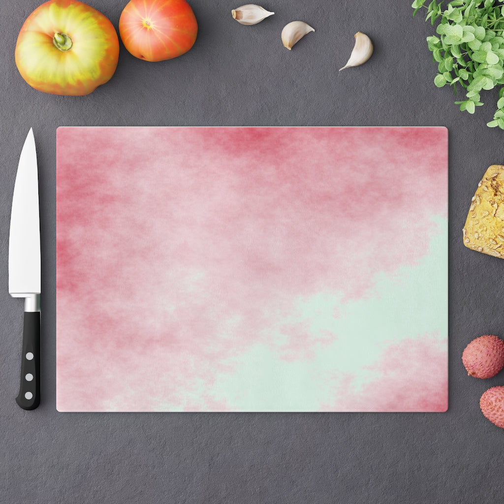 Red Clouds Cutting Board made of tempered glass with a vibrant red cloud design and rubber dots for stability.