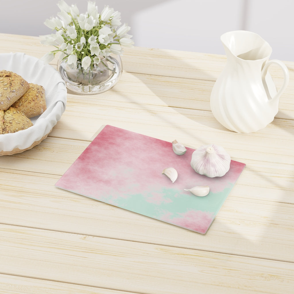 Red Clouds Cutting Board made of tempered glass with a vibrant red cloud design and rubber dots for stability.