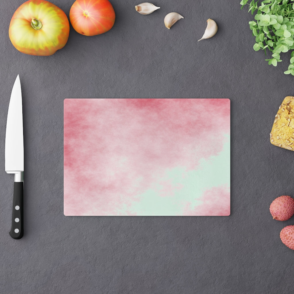 Red Clouds Cutting Board made of tempered glass with a vibrant red cloud design and rubber dots for stability.