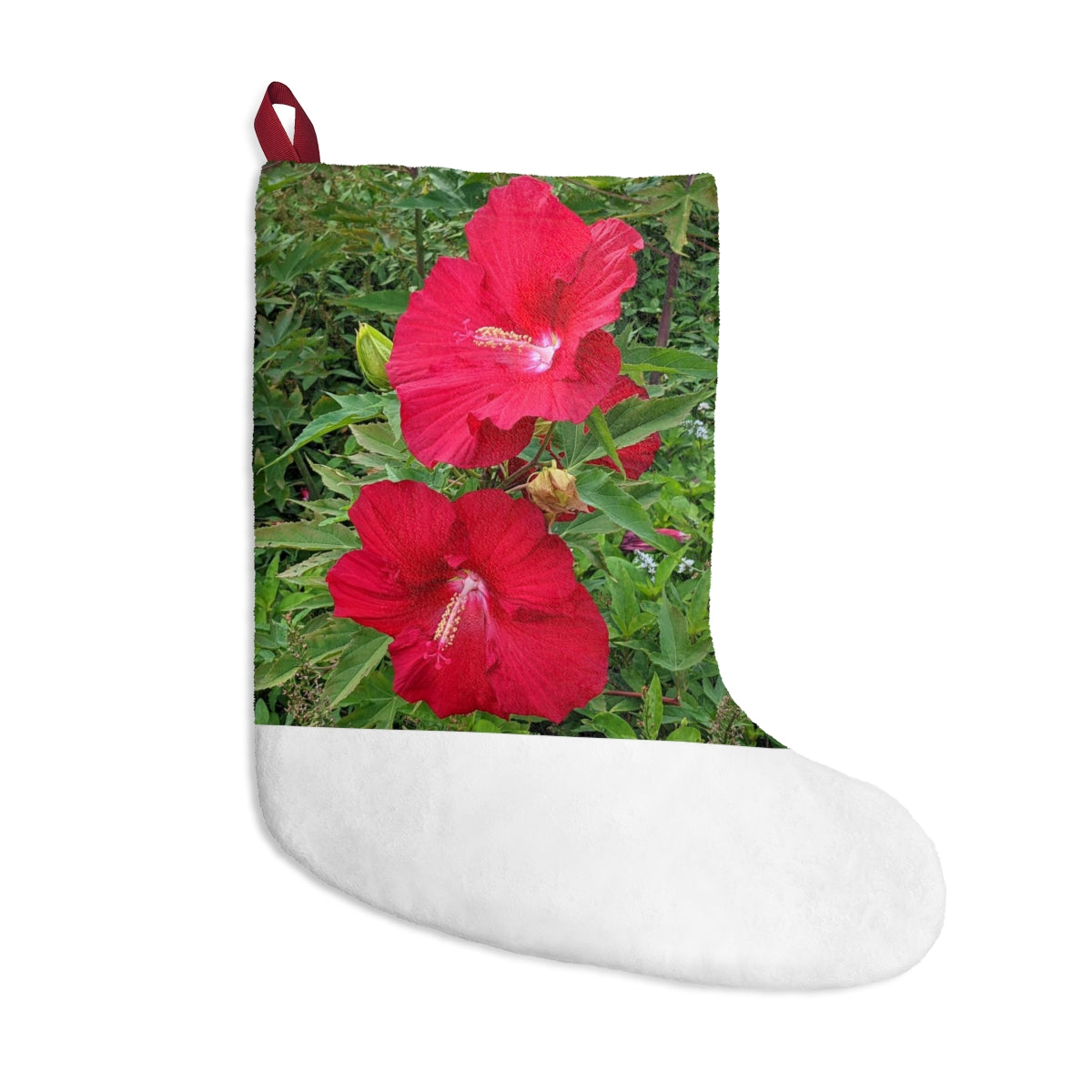 A pair of vibrant red flowers Christmas stockings hanging by a fireplace, showcasing their soft fleece material and personalized design.