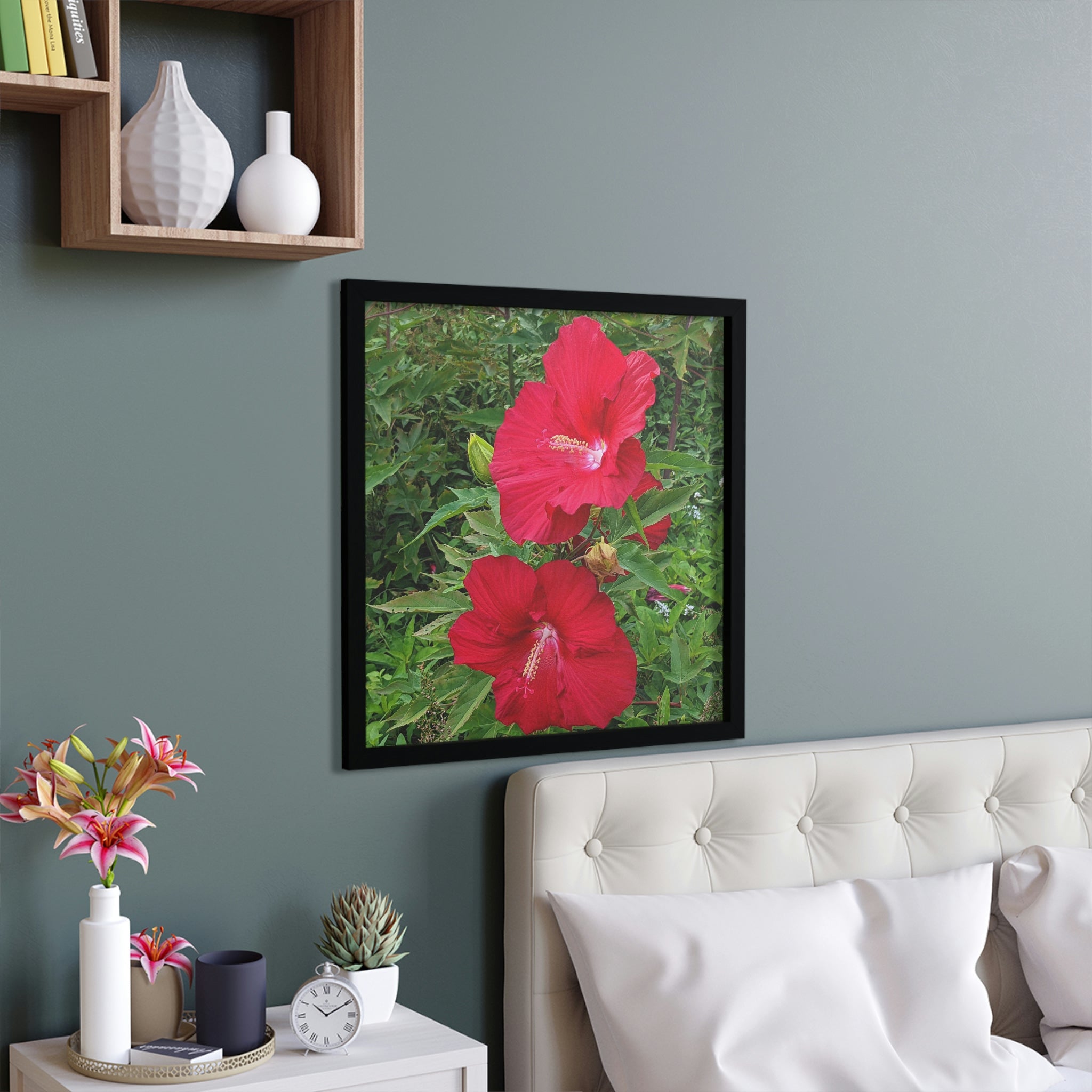 A beautifully framed poster featuring vibrant red flowers, set in a hand-crafted wooden frame, ready for hanging.