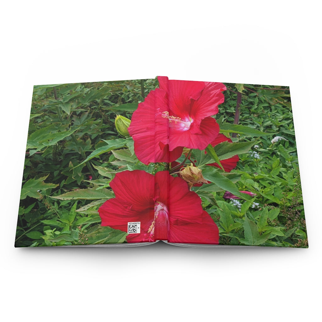 A beautifully designed Red Flowers Hardcover Journal with a matte finish, featuring vibrant floral patterns on the cover.