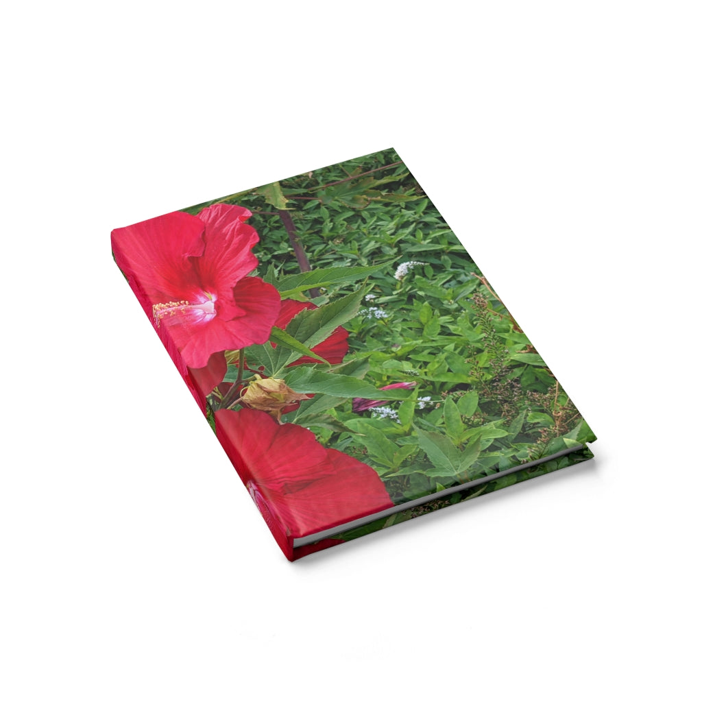 A hardcover journal featuring a vibrant red flowers design, showcasing its blank pages and durable casewrap binding.