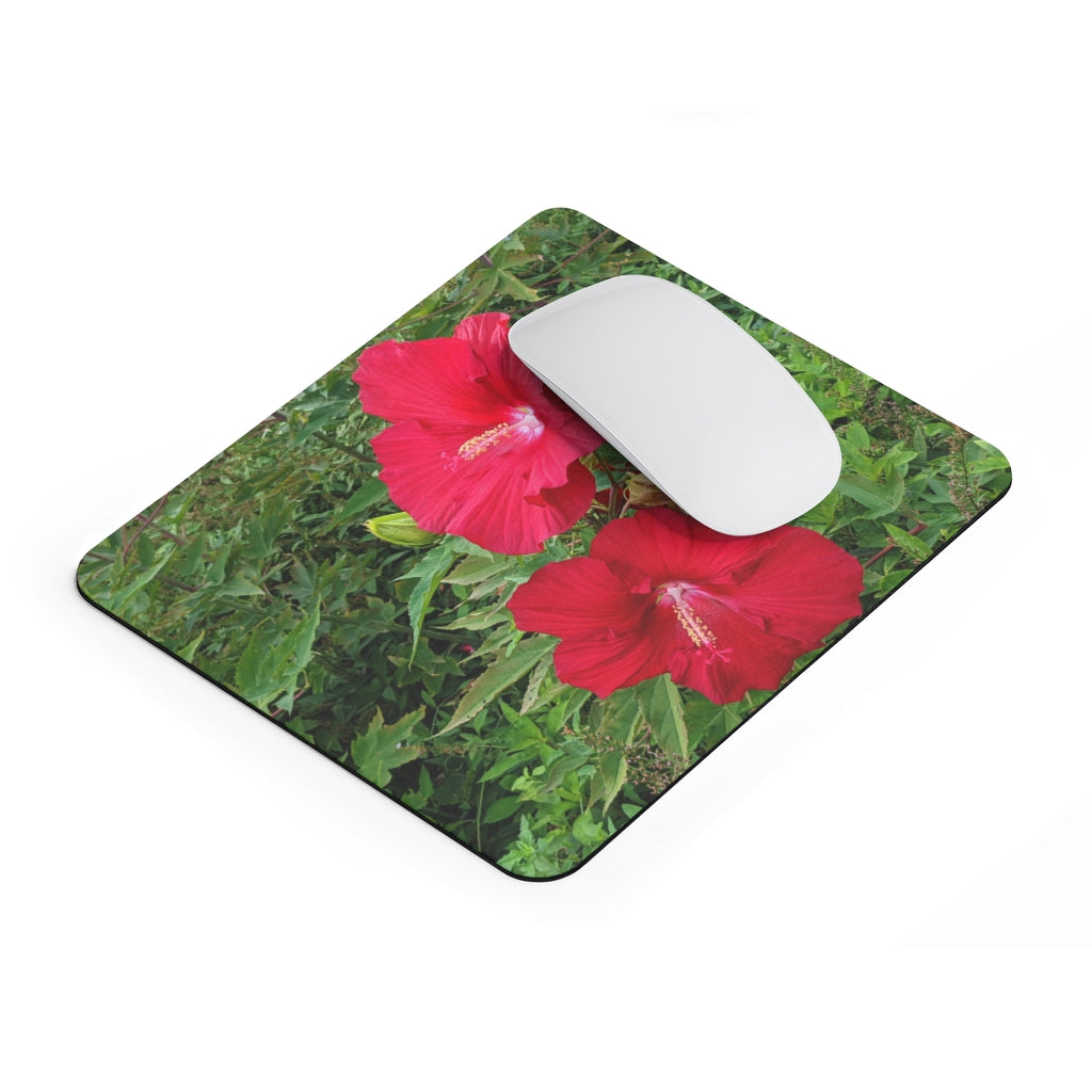 A vibrant red flowers mouse pad featuring a smooth surface and non-slip backing, perfect for enhancing any desk decor.