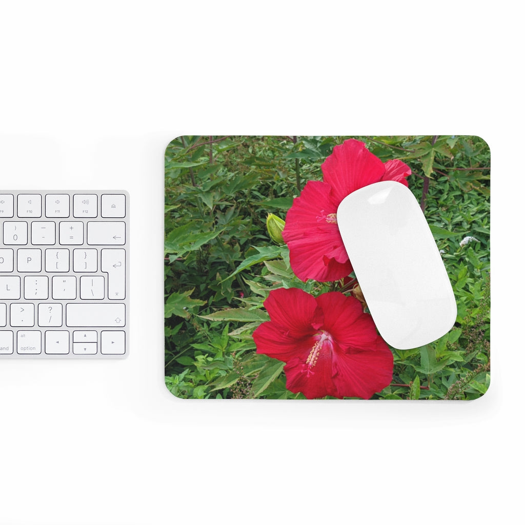 A vibrant red flowers mouse pad featuring a smooth surface and non-slip backing, perfect for enhancing any desk decor.