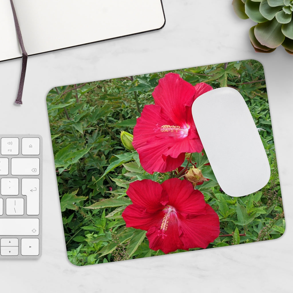 A vibrant red flowers mouse pad featuring a smooth surface and non-slip backing, perfect for enhancing any desk decor.