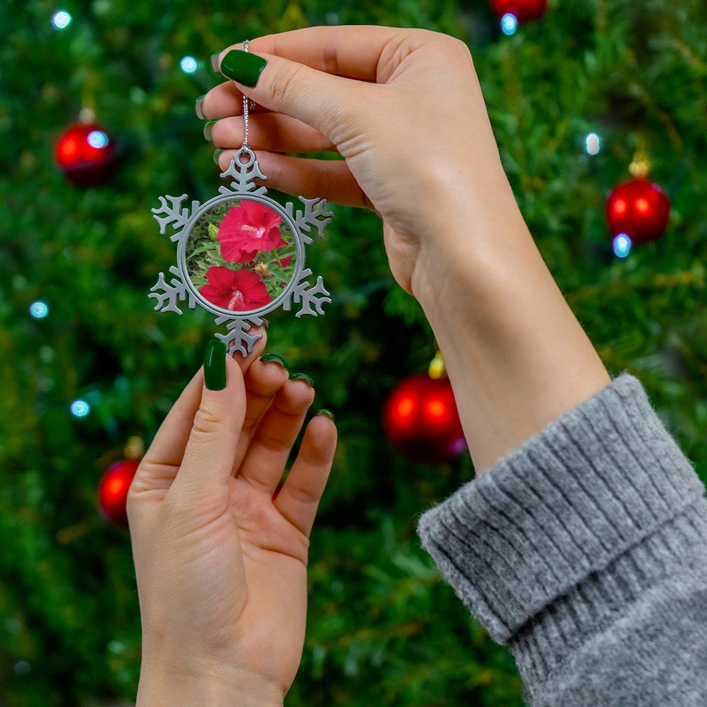 A beautifully crafted Red Flowers Pewter Snowflake Ornament with intricate details and a silver-toned hanging string, perfect for holiday decor.