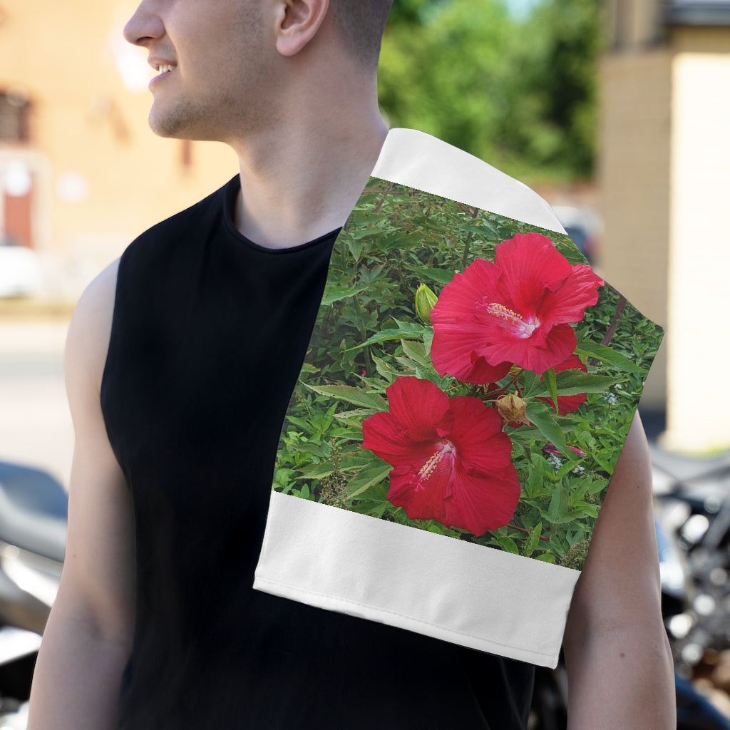 Red Flowers Rally Towel featuring a vibrant floral design, made from soft polyester and absorbent cotton.