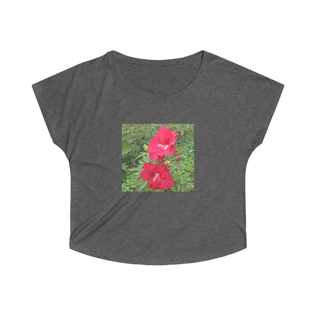 A stylish Red Flowers Women's Tri-Blend Dolman tee showcasing its loose fit and soft fabric, perfect for casual wear.