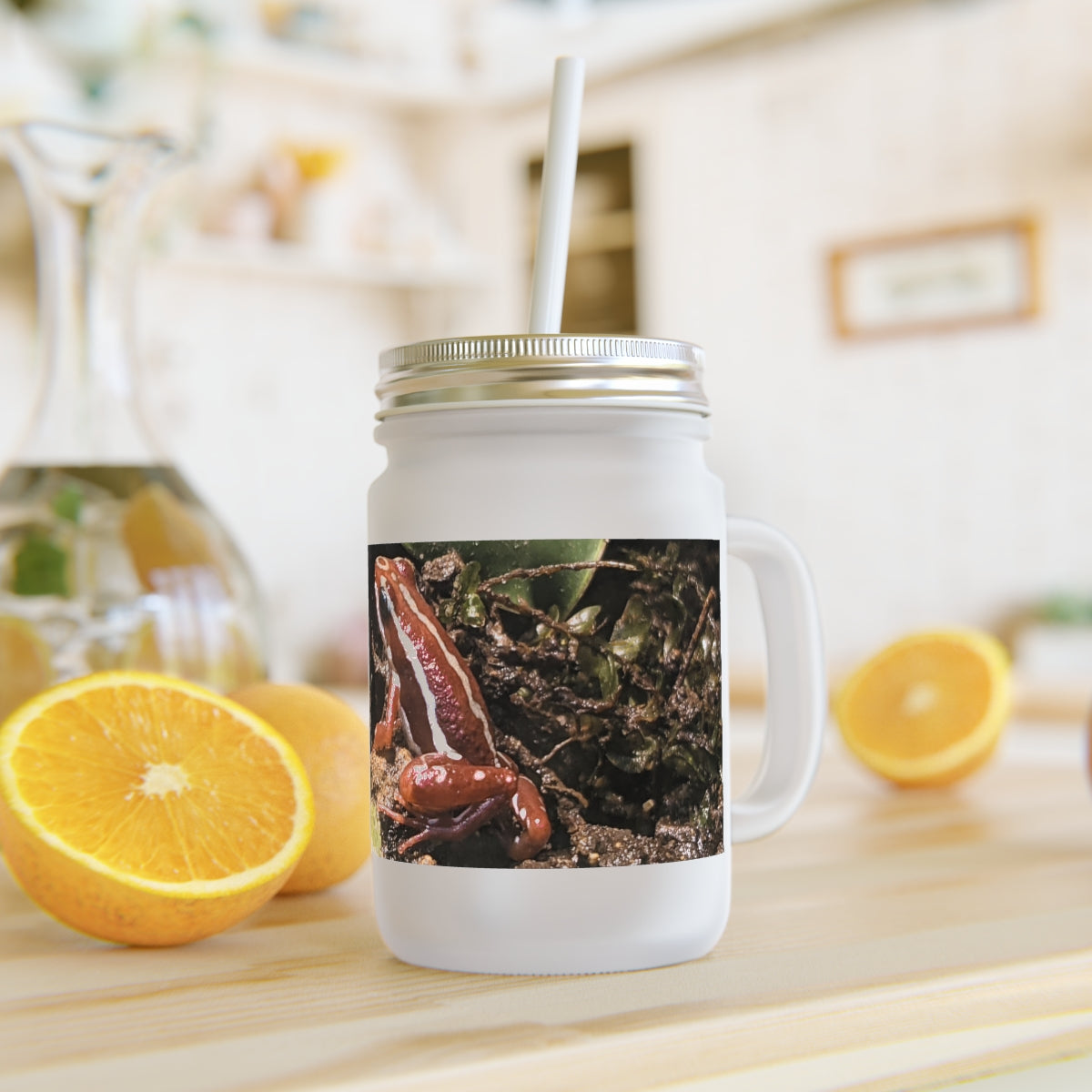 A stylish Red Frog Mason Jar made of frosted glass, featuring a straw and lid, perfect for personalized drinks.