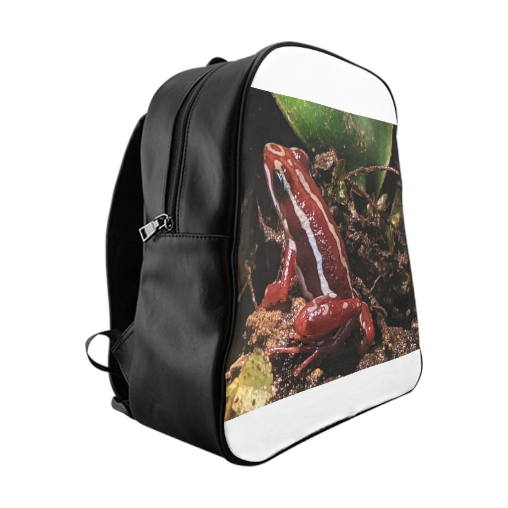 Red Frog School Backpack featuring a vibrant frog design, padded back, and multiple inside pockets, made from durable PU leather.