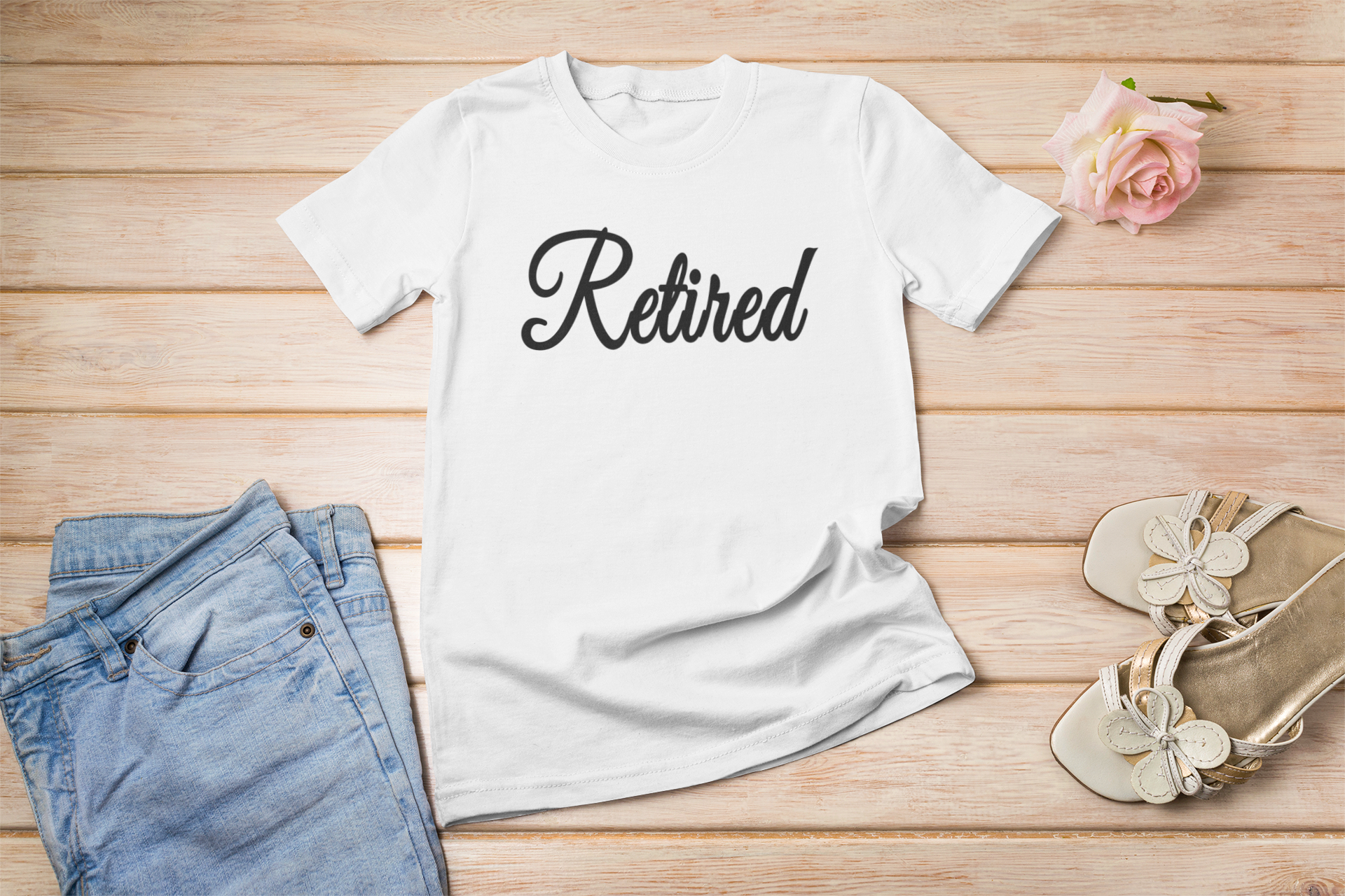 A stylish unisex Retired Lettering T-shirt featuring bold lettering design, perfect for casual wear.