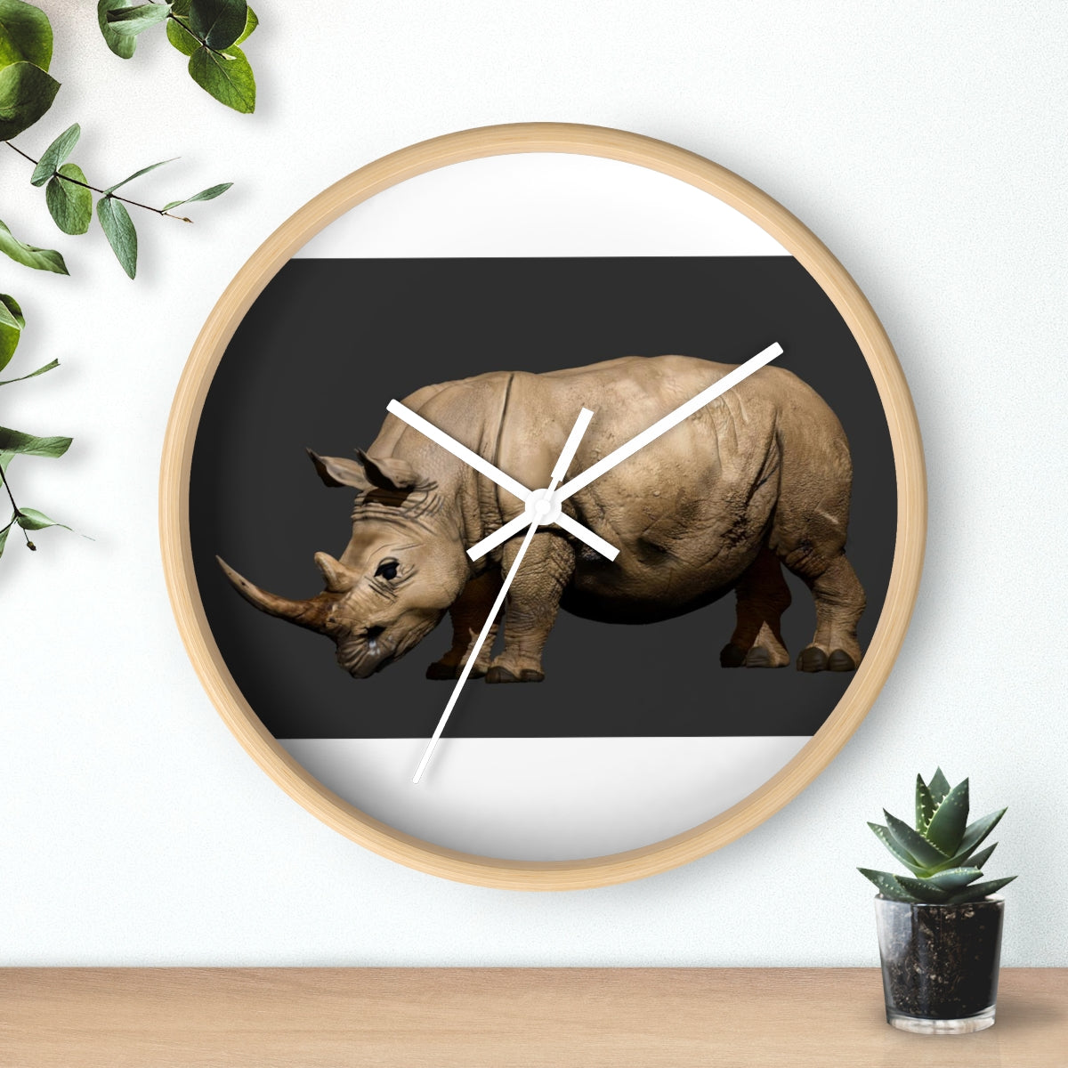 Rhino Wall Clock featuring a wooden frame and plexiglass face, showcasing a unique rhino design.