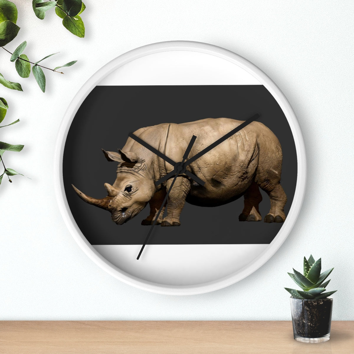 Rhino Wall Clock featuring a wooden frame and plexiglass face, showcasing a unique rhino design.