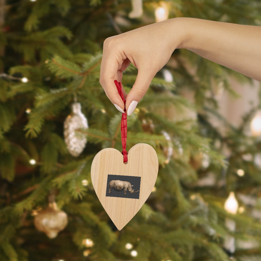 A collection of Rhino Wooden Christmas Ornaments in various whimsical shapes, featuring a rustic wood finish and red ribbons for hanging.