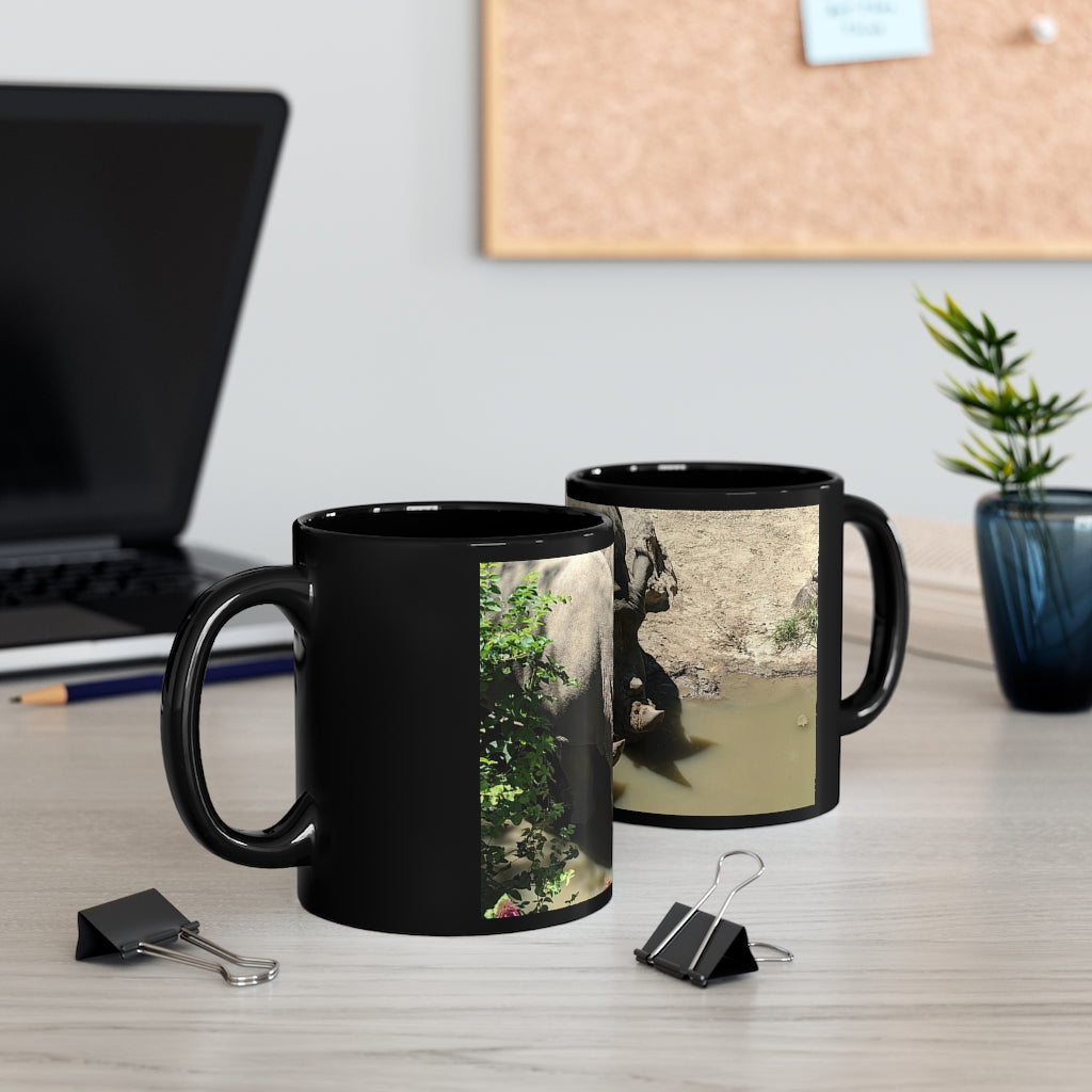 Rhinos Black mug 11oz showcasing a sleek black ceramic design with rounded corners and a comfortable C-handle.