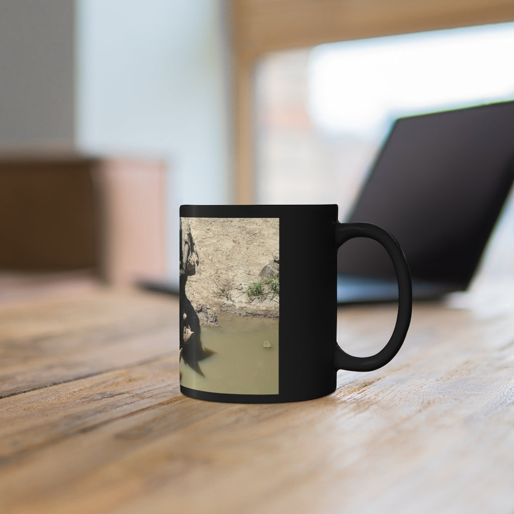 Rhinos Black mug 11oz showcasing a sleek black ceramic design with rounded corners and a comfortable C-handle.