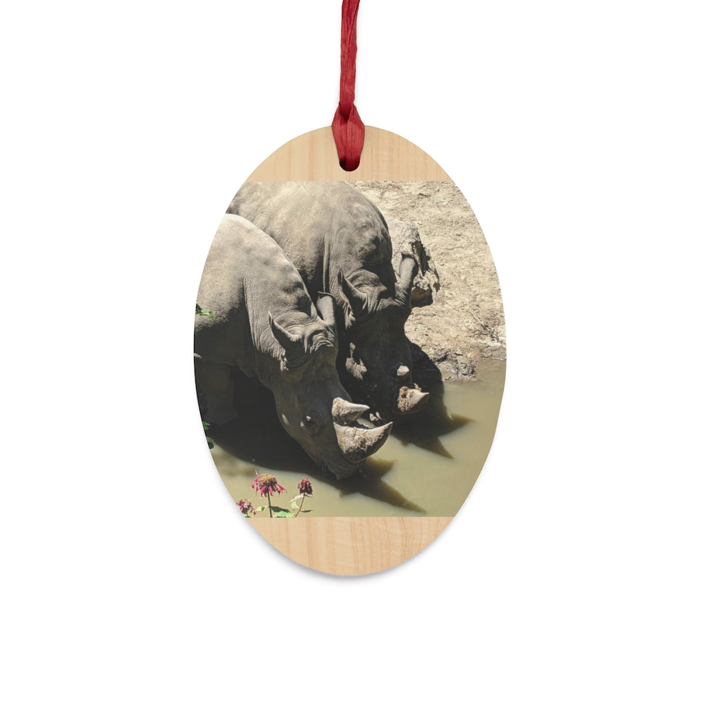 Rhinos Wooden Christmas Ornaments in various whimsical shapes, crafted from solid wood with a rustic finish and red ribbons for hanging.