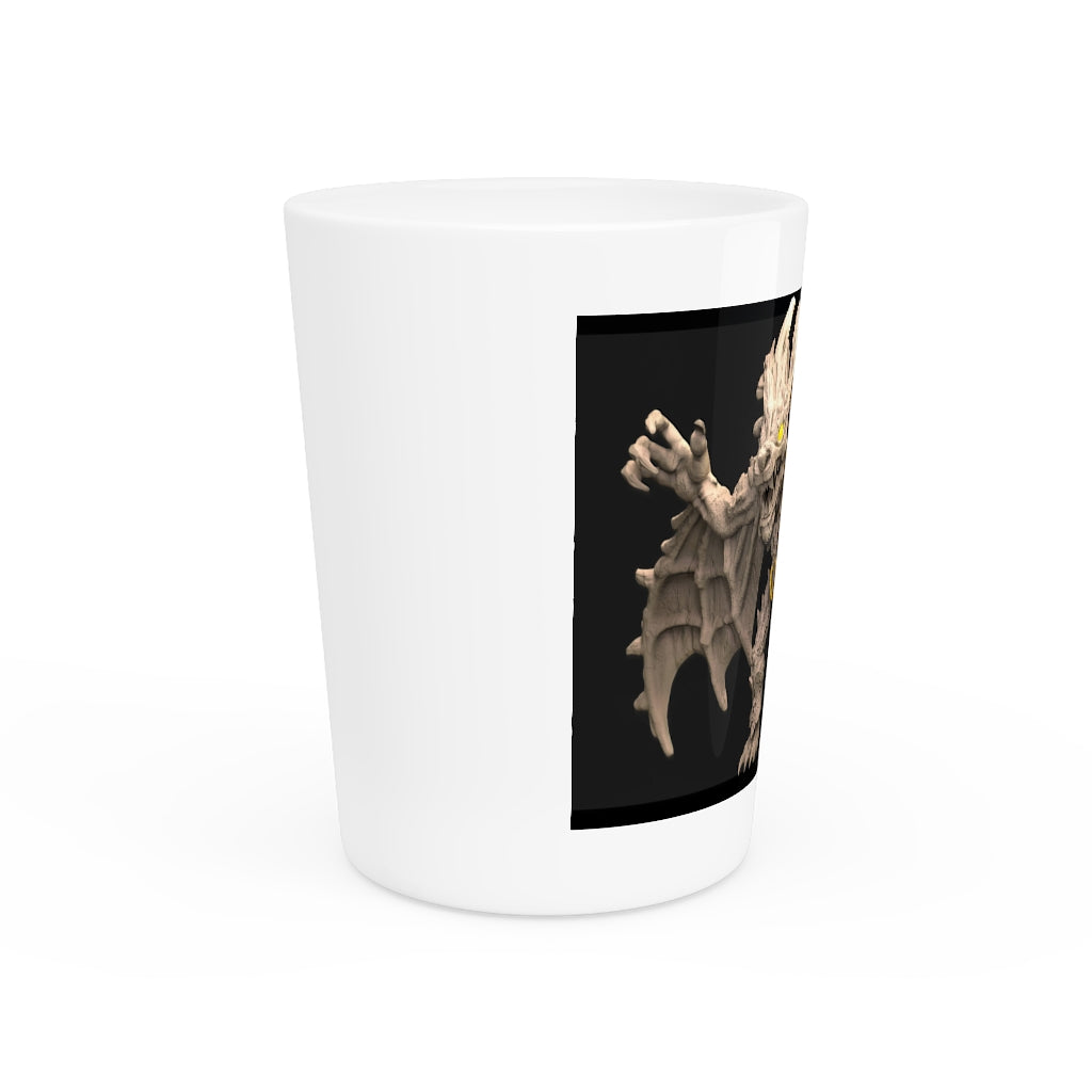 A personalized Rock Creature Shot Glass made of white ceramic with a customizable black or white interior, perfect for gatherings and gifts.