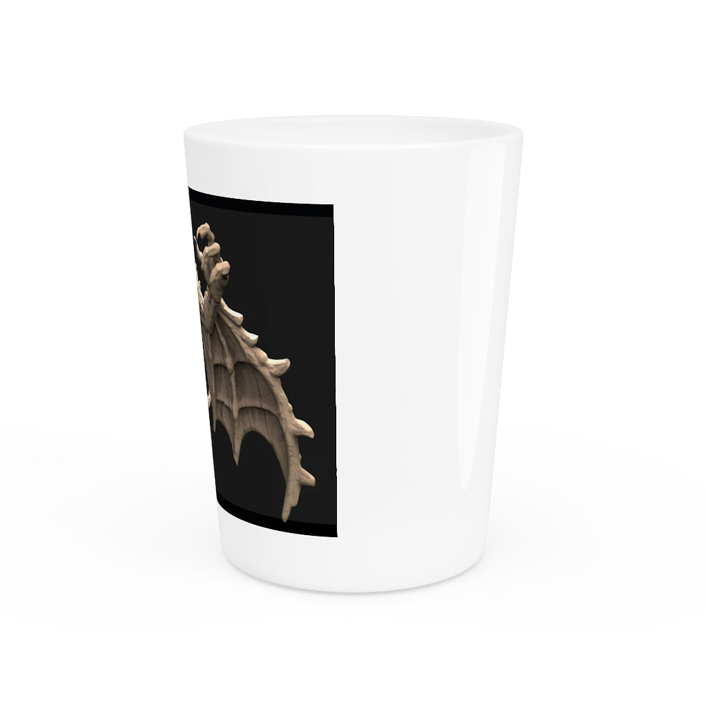 A personalized Rock Creature Shot Glass made of white ceramic with a customizable black or white interior, perfect for gatherings and gifts.