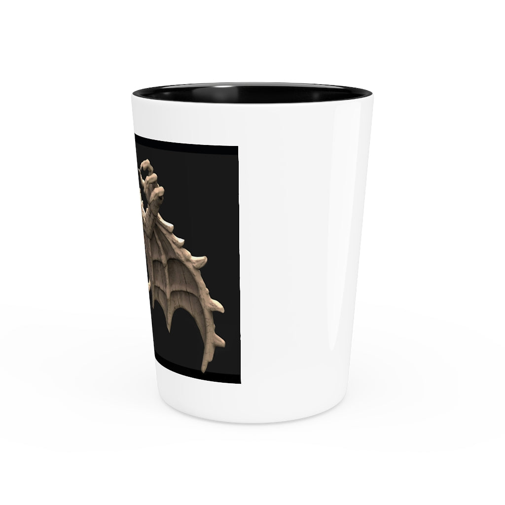 A personalized Rock Creature Shot Glass made of white ceramic with a customizable black or white interior, perfect for gatherings and gifts.