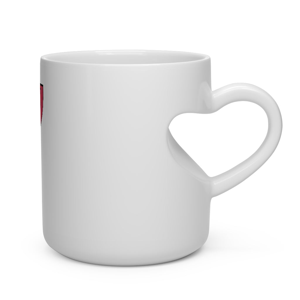 A white ceramic mug shaped like a heart with a heart-shaped handle, perfect for hot beverages.