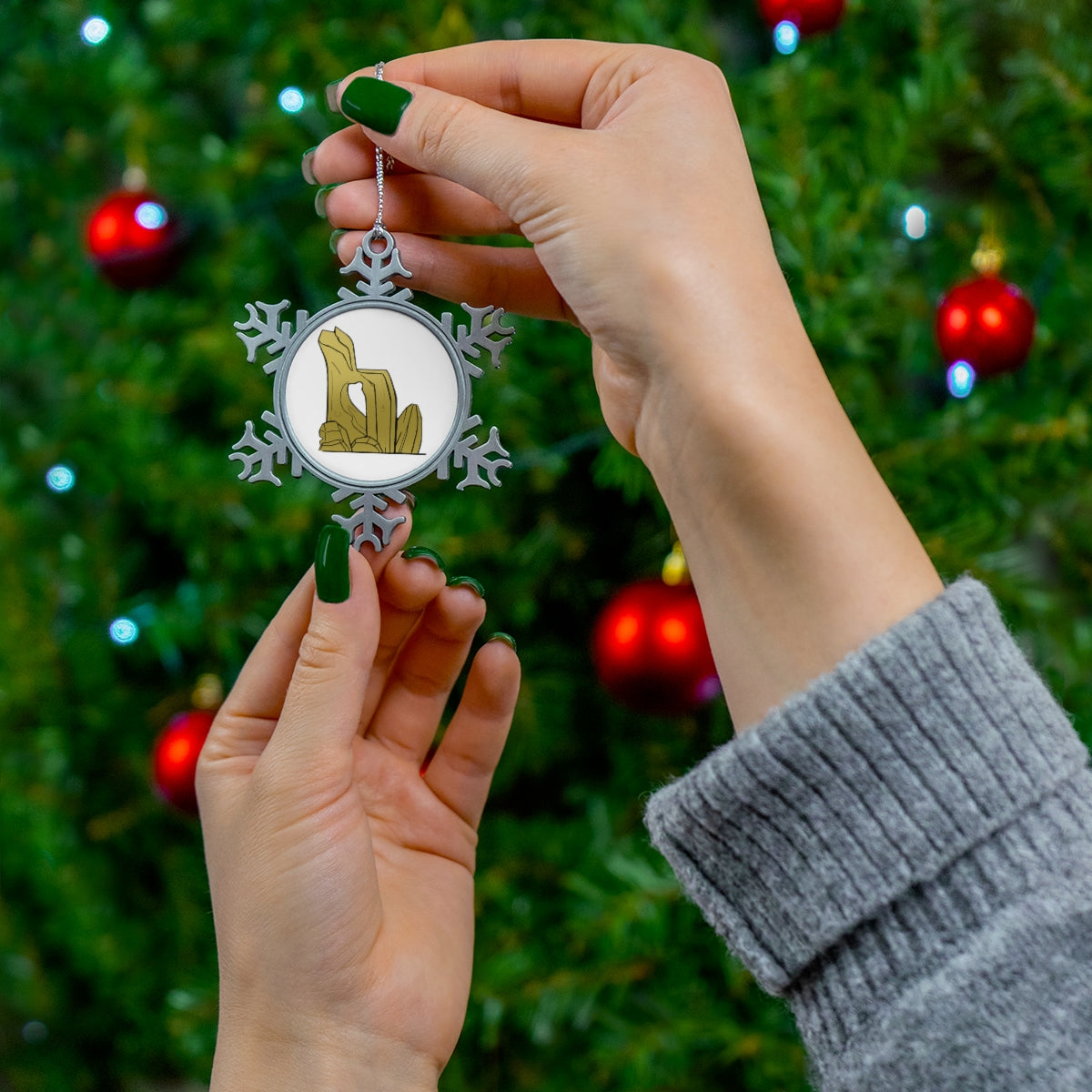 Rock Pewter Snowflake Ornament with silver-toned hanging string, showcasing intricate snowflake design.