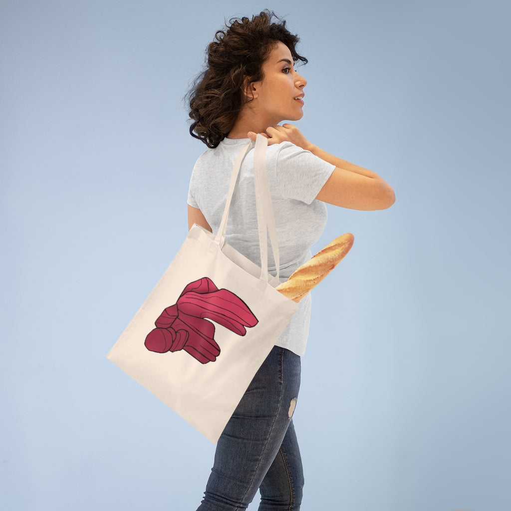 A stylish Rock Tote Bag made of 100% cotton, featuring long handles and cross stitching for added durability, available in multiple colors.