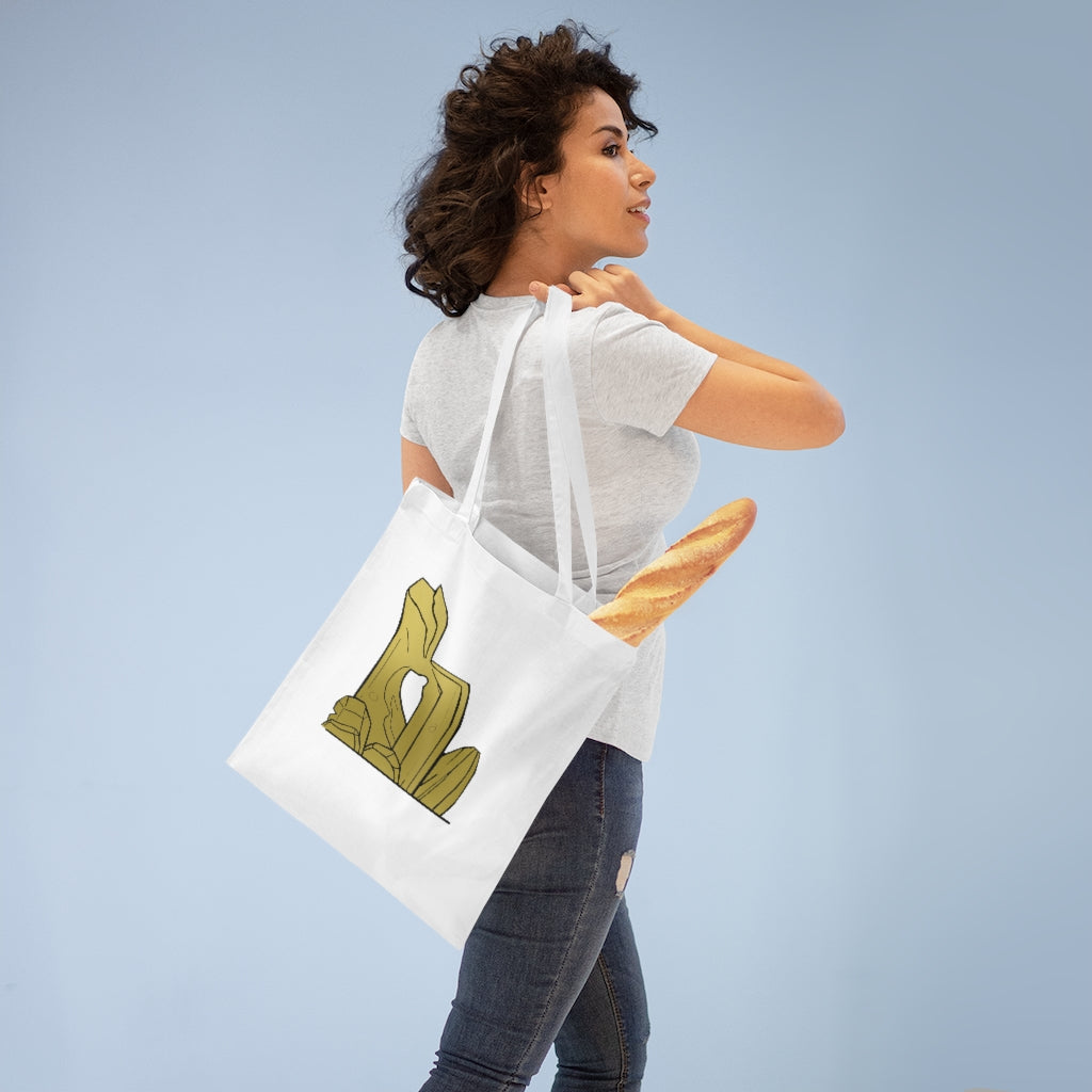 A stylish Rock Tote Bag made of 100% cotton, featuring long handles and cross stitching for added stability, available in various colors.