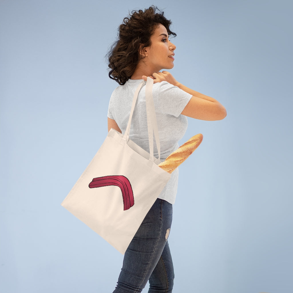 A stylish Rock Tote Bag made of 100% cotton, featuring long handles and cross stitching for durability, available in various colors.